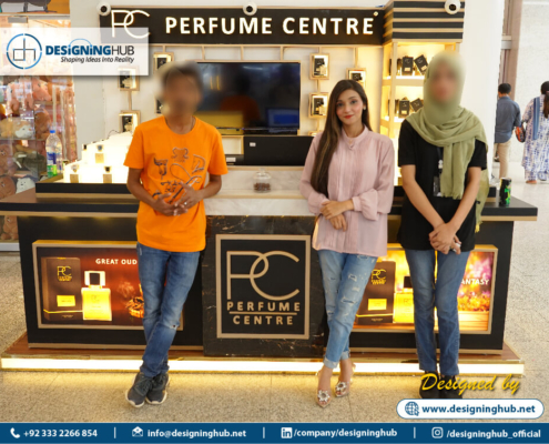 Customers browsing PC Premium perfume stall at LuckyOne Mall – functional retail kiosk design by Pakistan’s top fabricators
